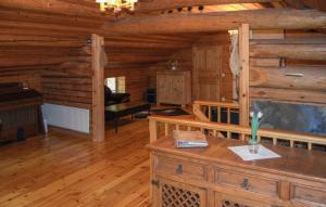 a living room in a log cabin at Lovely Home In Kopparberg With Sauna in Kopparberg