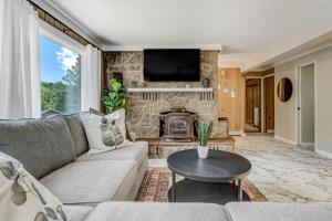 a living room with a couch and a fireplace at 4925 Pike Unit1 in Cascade-Chipita Park