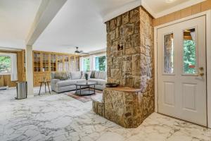 a living room with a stone wall at 4925 Pike Unit1 in Cascade-Chipita Park