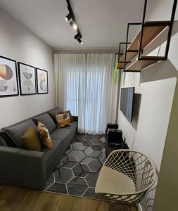 Posezení v ubytování Apartamento 5km de Alphaville com estacionamento