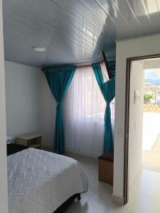 Postel nebo postele na pokoji v ubytování La Mesa Suites - Hermosa vista