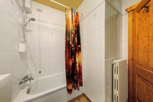 a bathroom with a shower and a bath tub at Appartamento Privato Nelle Dolomiti in Vodo Cadore +18 photos