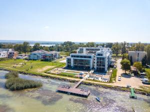 an aerial view of a building next to a river at Sunset Resort 408 in Fonyód +6 photos