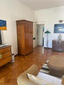a living room with a couch and a cabinet at Casa panoramica del Xll secolo in Vieste