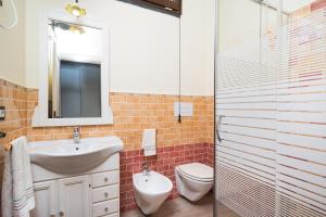 a bathroom with a sink and a toilet and a mirror at casa Luna in Dorgali +15 photos