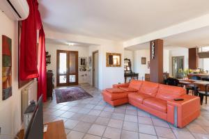 a living room with a couch and a table at Water Front Scopello in Scopello