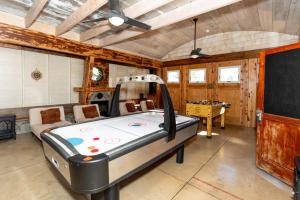 a large room with a bed and a table at Waterfront Luxury Family Retreat in Sandusky