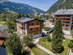 an aerial view of a building with mountains in the background at Villa Felding Top 4 in Bad Hofgastein