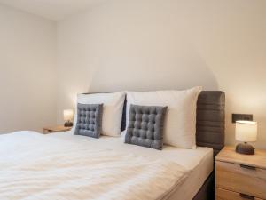 a bedroom with a bed with two pillows at Villa Felding Top 4 in Bad Hofgastein
