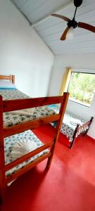 Ένα ή περισσότερα κρεβάτια σε δωμάτιο στο Pousada Carrosel