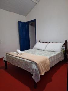 Ένα ή περισσότερα κρεβάτια σε δωμάτιο στο Pousada Carrosel +8 φωτογραφίες