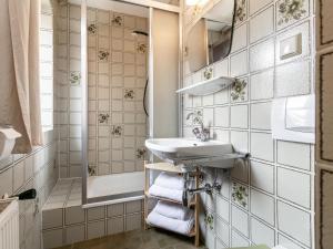 a bathroom with a sink and a shower at Pension Schreder in Kirchberg in Tirol +32 photos