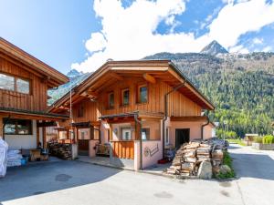 a house with mountains in the background at Haus Oliver 1 in Längenfeld