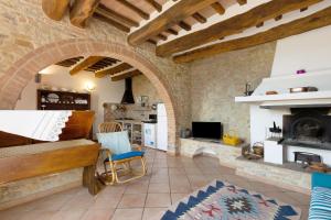 a living room with a piano and a fireplace at La Ripa - Appartamento I Ghiri in San Gimignano