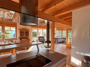 a kitchen and living room in a log cabin at Landhaus St Georgen im Gailtal in Emmersdorf