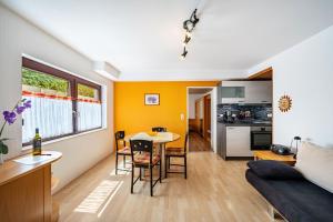 a living room with a couch and a table at Haus Am Weinberg in Endingen