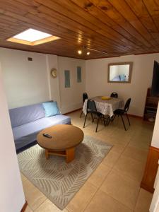 a living room with a couch and a table at Cabaña en el Interior in Tongoy