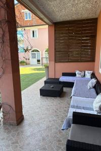 two beds in a room with a courtyard at Apartments by the sea Novigrad - 24877 in Novigrad Istria