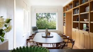 a room with a table and chairs and a window at Hazelwood House in Mittagong