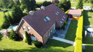 an overhead view of a house with a roof at Ferienhaus Behrends in Emden
