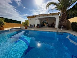 a swimming pool in front of a house at Casa Miantojo in Mazarrón +37 photos