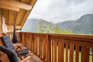 a deck with a view of a mountain at Valentin36 Apartment Ritten in Funes