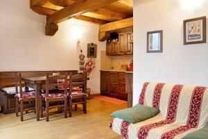 a kitchen and dining room with a table and chairs at Casa sul Fiume-zona Limone Piemonte in Vernante