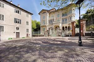 a large building with a street light in front of it at Edda's apartment in Altare