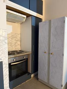 a kitchen with a stove and a refrigerator at Starlight Nights in Bradford