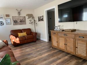 a living room with a couch and a chair at Little Sunshine in Ocala