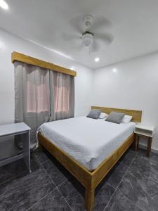 Ένα ή περισσότερα κρεβάτια σε δωμάτιο στο Beautiful house with access to a private beach