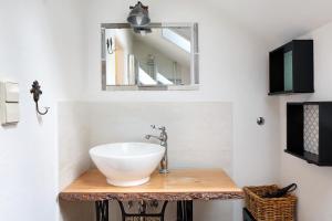 a bathroom with a sink and a mirror at Feldbergstern in Feldberg +17 photos
