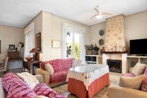 a living room with couches and a fireplace at Sol, playa y diversion en Roche in Roche