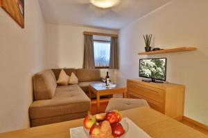 Televízia a/alebo spoločenská miestnosť v ubytovaní Apartmenthaus Jörg - im Sommer INKLUSIVE Super-Sommer-Card