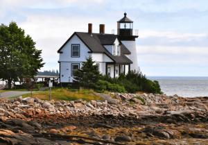 a lighthouse on the shore of the ocean at Bay View A-Frame, Firepit, Bath Tub, Near Acadia in Gouldsboro
