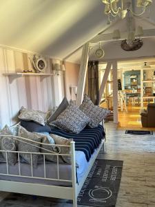 a bed with pillows on it in a room at Thüringer Landidyll in Bösleben-Wüllersleben