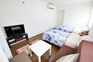 Postel nebo postele na pokoji v ubytování Comore Villa 1F