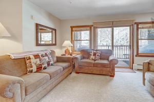 a living room with a couch and a chair at CS110 Copper Springs condo in Copper Mountain