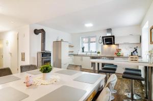 a kitchen with a table and chairs in a room at Salem´s Treasure Manor in Salem