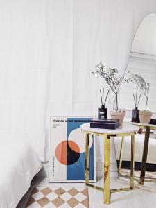 a living room with a table and a book at Namsan Nest in Seoul