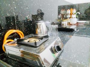 a kitchen counter with a coffee maker on it at S97 Weligama in Weligama +8 photos
