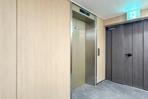 an elevator in a building with a door at 전주 써밋스테이 