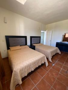 A bed or beds in a room at Casa Rinconsito Miramar