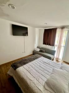 Ένα ή περισσότερα κρεβάτια σε δωμάτιο στο Casa Galerias Serdan II