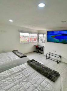 Ένα ή περισσότερα κρεβάτια σε δωμάτιο στο Casa Galerias Serdan II