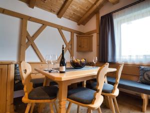 a dining room with a wooden table and chairs at Aparthotel Monte 44 in Selva di Val Gardena +17 photos