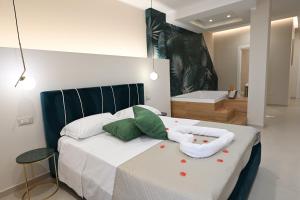 a bedroom with a bed with a bath tub at Baffone Hotel in Castel Volturno