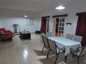 a dining room with a table and chairs in a room at La Elena in La Rioja