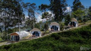 a row of tents on top of a hill at Fortune Glamping in Dieng +18 photos