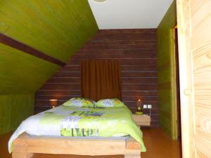 a bedroom with a bed in a room at Éco-Gîte Rénové avec Spa Partagé et Jardin - FR-1-489-290 in Bransat